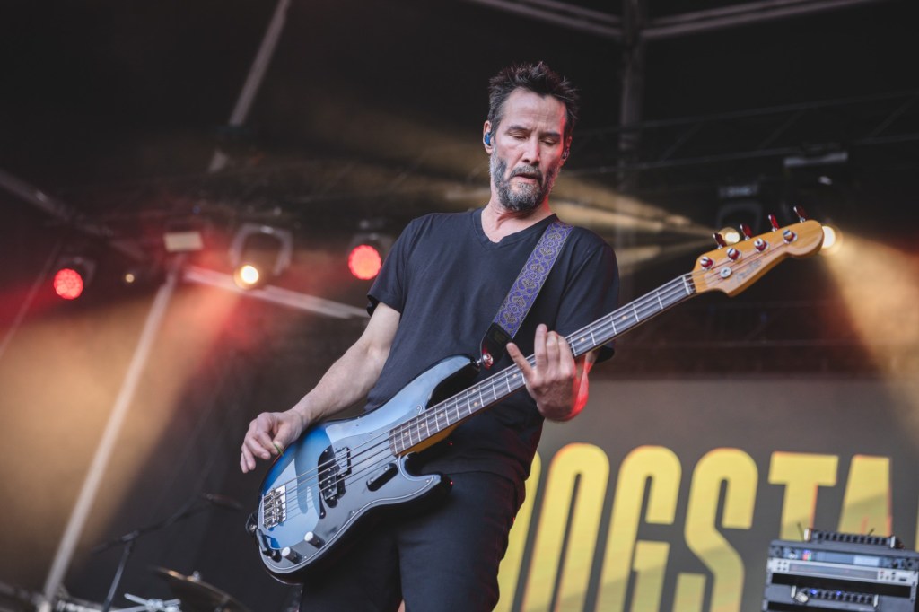Keanu Reeves Gets ‘Love Will Tear Us Apart’ Dedicated to Him at Peter Hook Show
