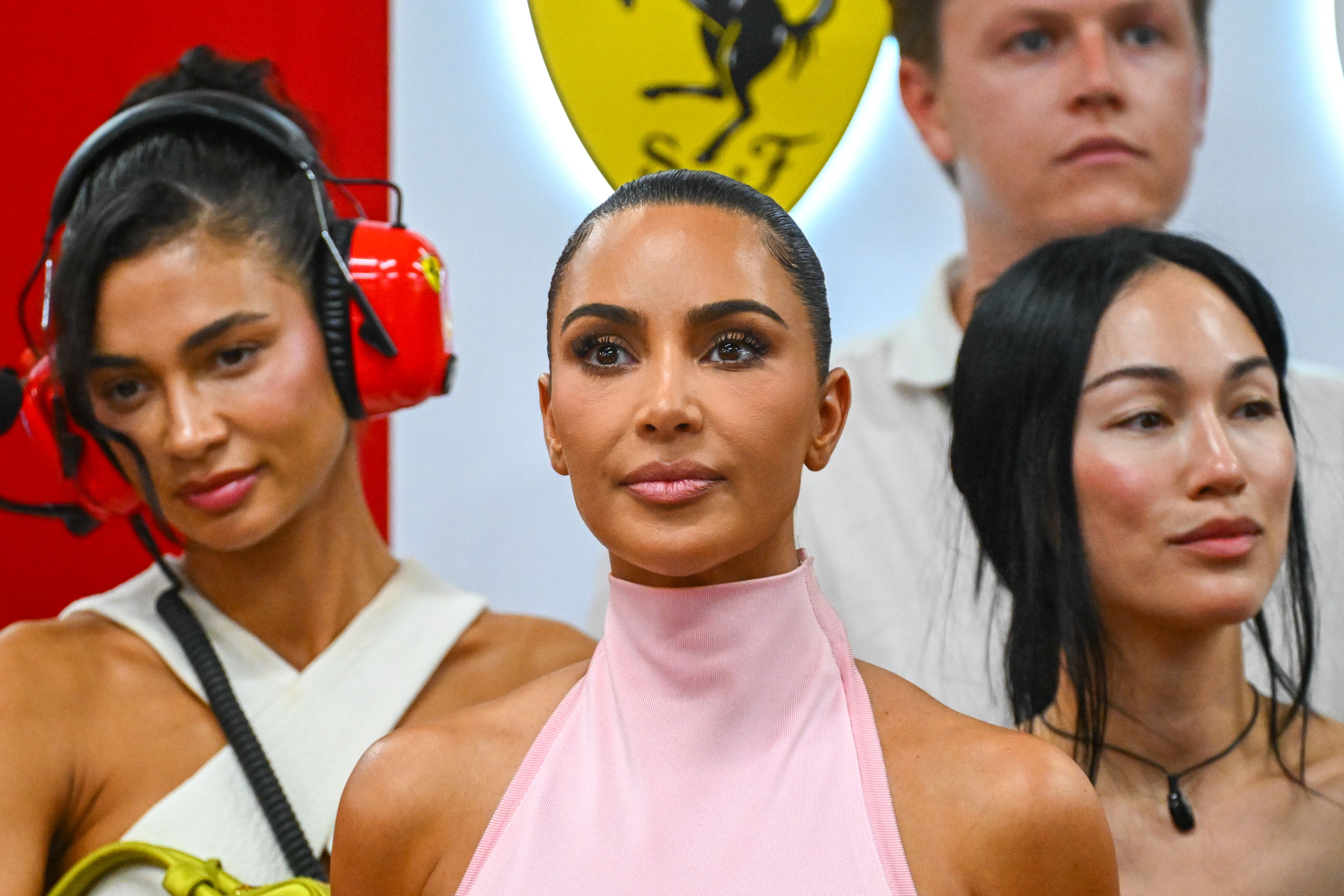 Forget Ferrari Red: Kim Kardashian Pulls up to the Paddock in Pastel Pink
