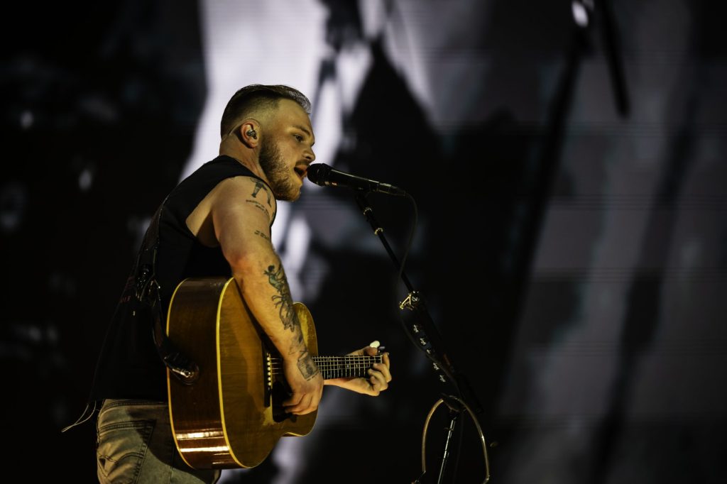 Zach Bryan Wears ‘Free Palestine’ Shirt at Robert Kraft’s Gillette Stadium