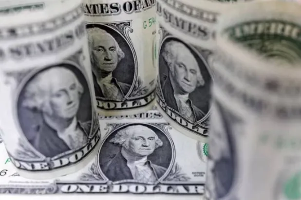 The dollar hits a 13-month high as bets on interest rate hikes rise